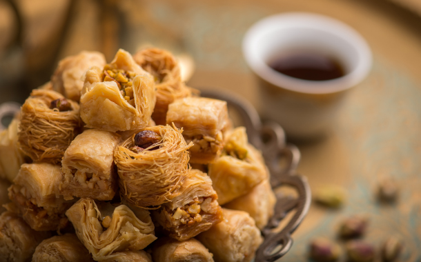 Baklava with arabic black coffee cup