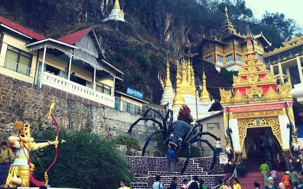 Statue of a prince releasing an arrow at the giant spider Statue of a prince releasing an arrow at the giant spider